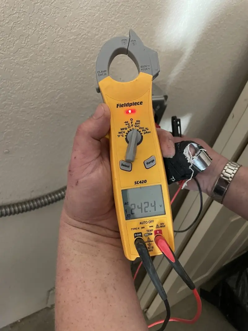 Voltage testing with clamp meter during Recessed Lighting Installation in Warren